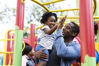 african-father-and-child-on-a-park
