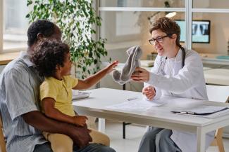 doctor-playing-with-little-child